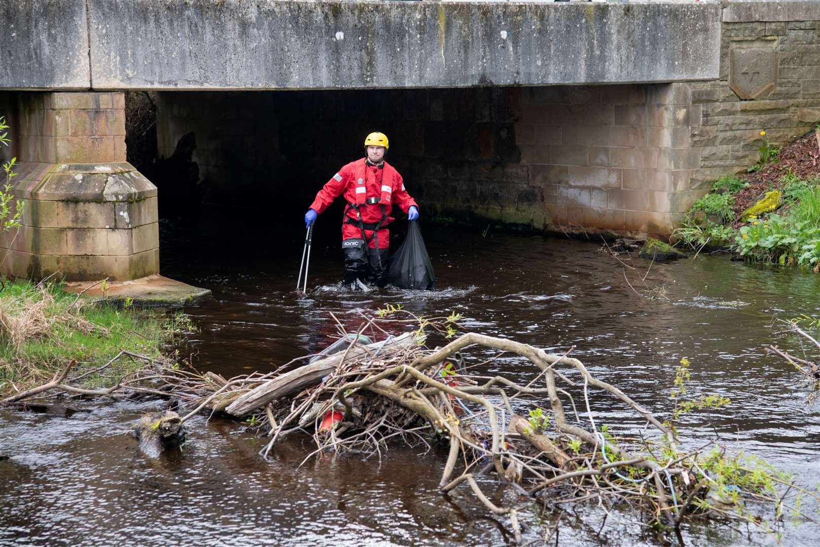 Around 30 bags of rubbish were pulled from the burn. Picture: Daniel Forsyth.