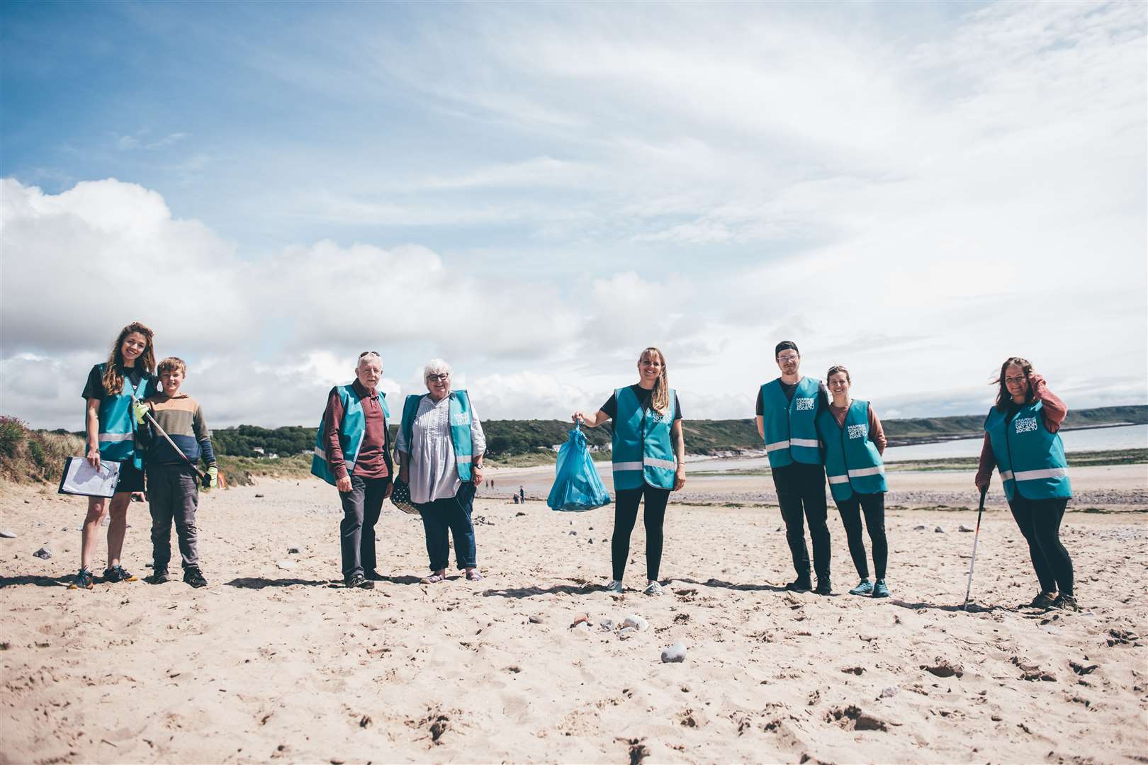 The Marine Conservation Society of volunteers taking part in their annual beach clean on Port Eynon Beach (Aled Llywelyn/Billy Barraclough/Marine Conservation Society/PA)